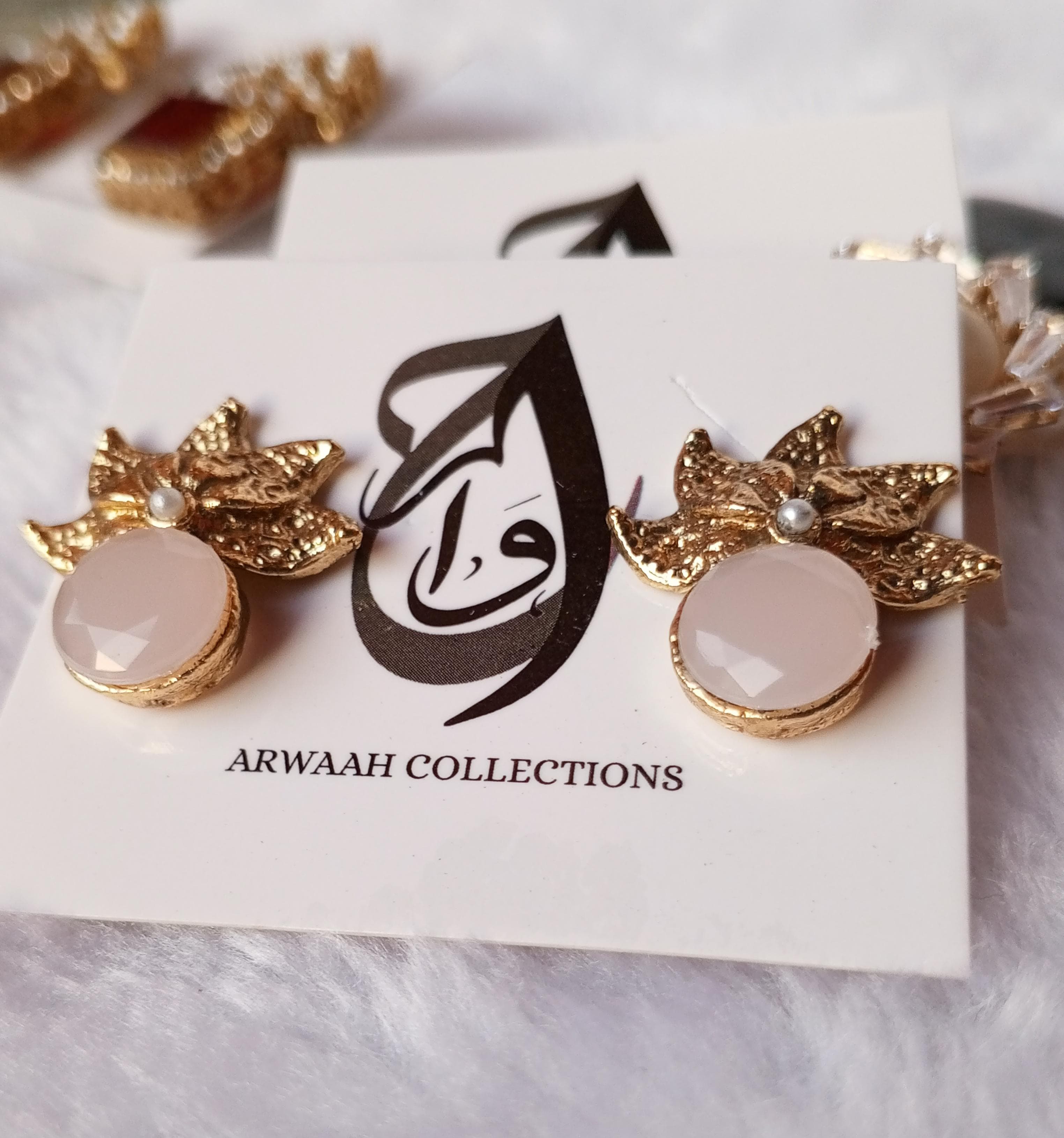 Elegant Zircon Leaf Tops with Soft Pink Stone – ARWAAH COLLECTIONS